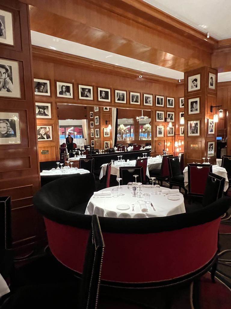 Iconic Le Fouquet’s restaurant on the Champs-Élysées in Paris, showcasing refined French dining with luxurious interiors and gourmet cuisine in a historic setting.