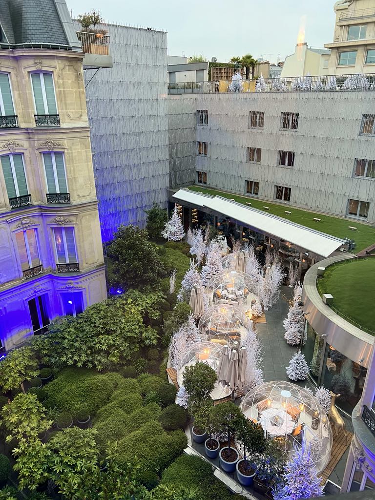 Whimsical Christmas bubble pop-up installation with glowing igloo-style domes, festive lighting, and immersive holiday decor—perfect for family photos and magical winter experiences.