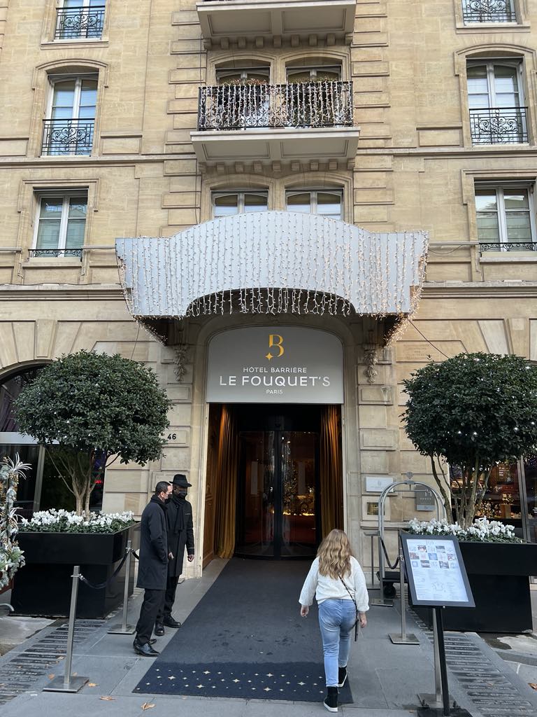 Stunning facade of Hôtel Barrière Le Fouquet’s Paris, a luxury five-star hotel on the iconic Champs-Élysées, blending classic Parisian architecture with modern sophistication.