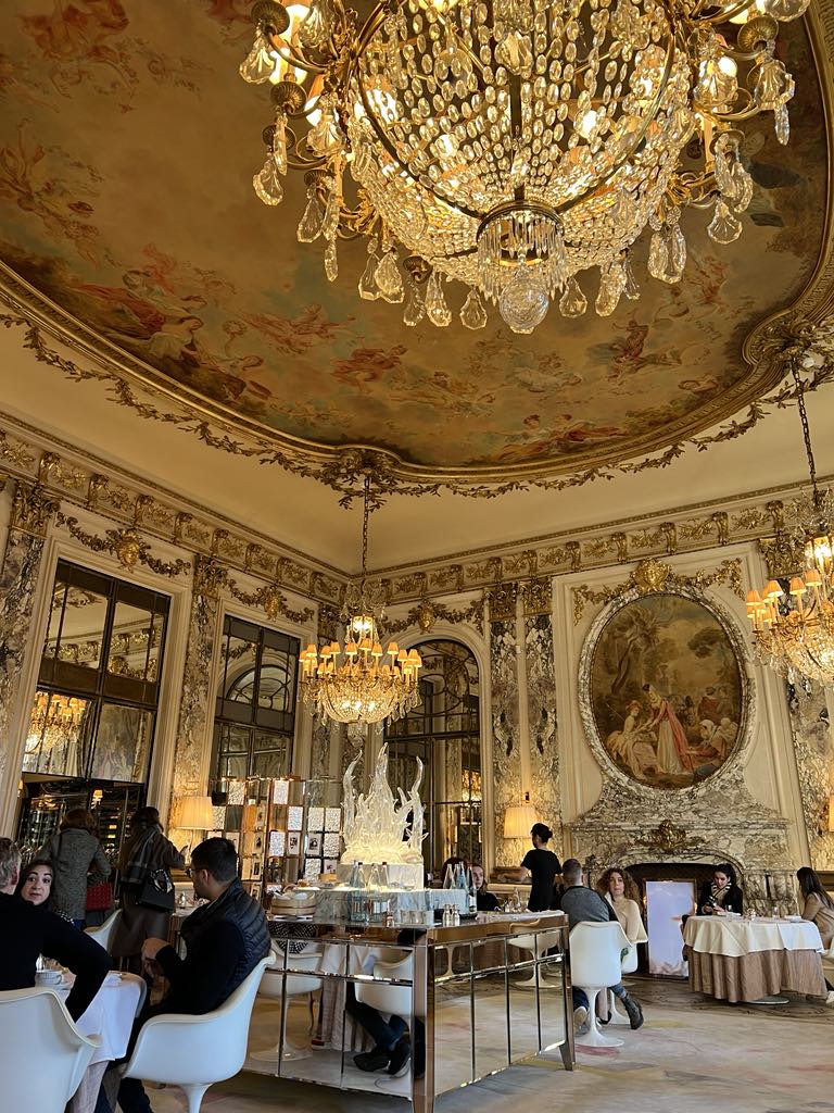 Luxurious hotel space adorned with historical artistic decor, including antique furnishings, ornate moldings, and curated artwork that reflects the property’s rich cultural heritage.