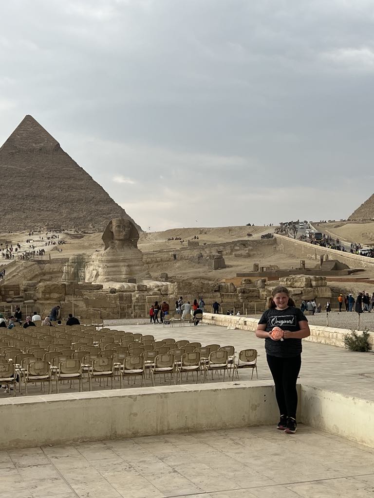 Girl Harper in front of Sphinx in Cairo Egypt