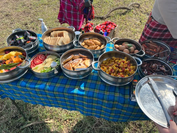 Delicious gourmet cuisine served at Cottar’s bush lunch in Kenya, featuring farm-to-table dishes during a luxury family safari experience.
