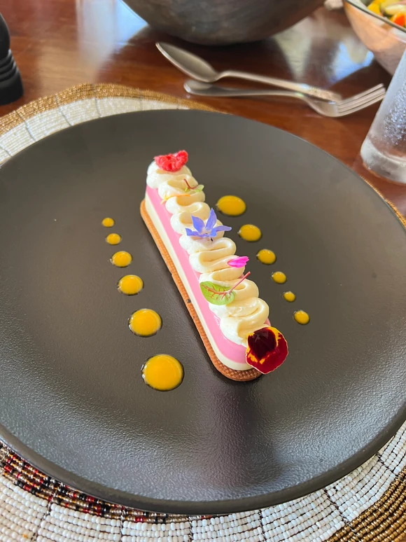 Elegant, chef-crafted dessert at Cottar’s 1920s Safari Camp in Kenya, highlighting luxury dining during a family safari experience.