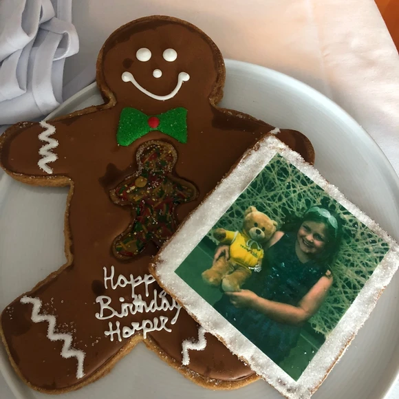 Personalized gingerbread cookie featuring Harper’s face, a festive and creative holiday surprise at Trump Hotel Chicago during a luxury family stay.