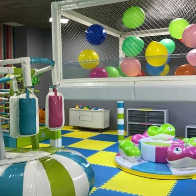 Family-friendly video game lounge at Grand Moon Palace Cancun, offering teens and kids interactive entertainment at a luxury all-inclusive resort in Mexico.