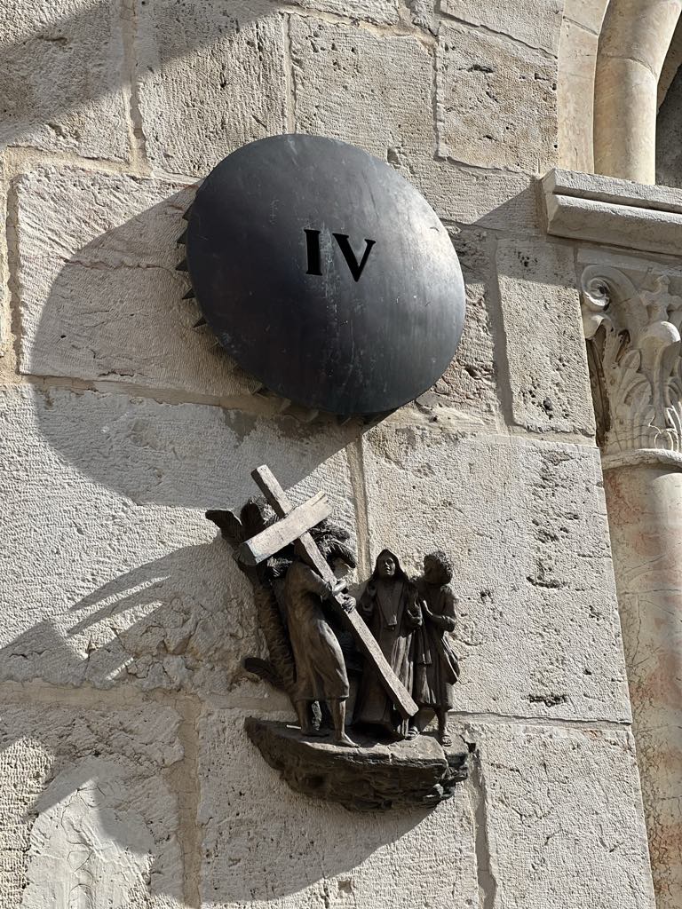 Via Dolorosa in Jerusalem, passing one of the Stations of the Cross marking Jesus’ path to crucifixion.