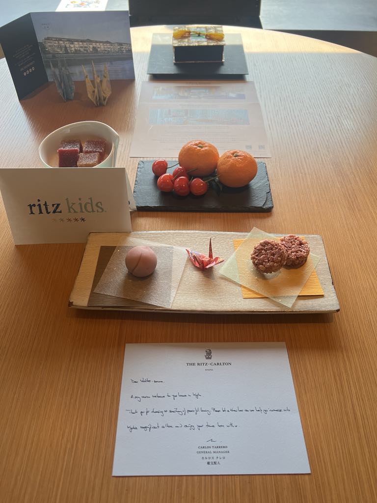 Luxury Ritz Kids amenity left in-room at The Ritz-Carlton Kyoto, featuring beautifully packaged treats and a personalized welcome for young guests during a family stay in Japan.