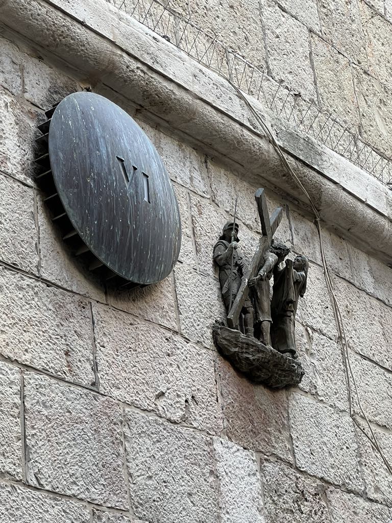 Via Dolorosa in Jerusalem, passing one of the Stations of the Cross marking Jesus’ path to crucifixion.