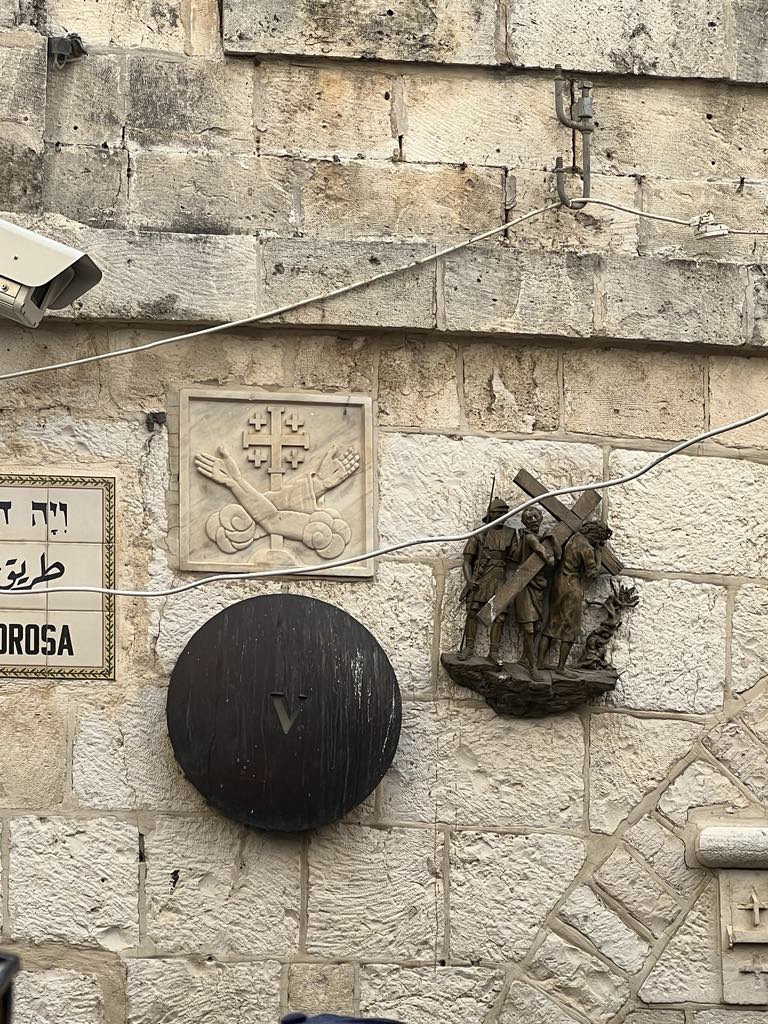 Via Dolorosa in Jerusalem, passing one of the Stations of the Cross marking Jesus’ path to crucifixion.