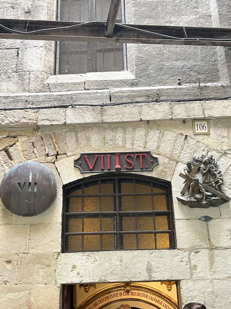 Via Dolorosa in Jerusalem, passing one of the Stations of the Cross marking Jesus’ path to crucifixion.