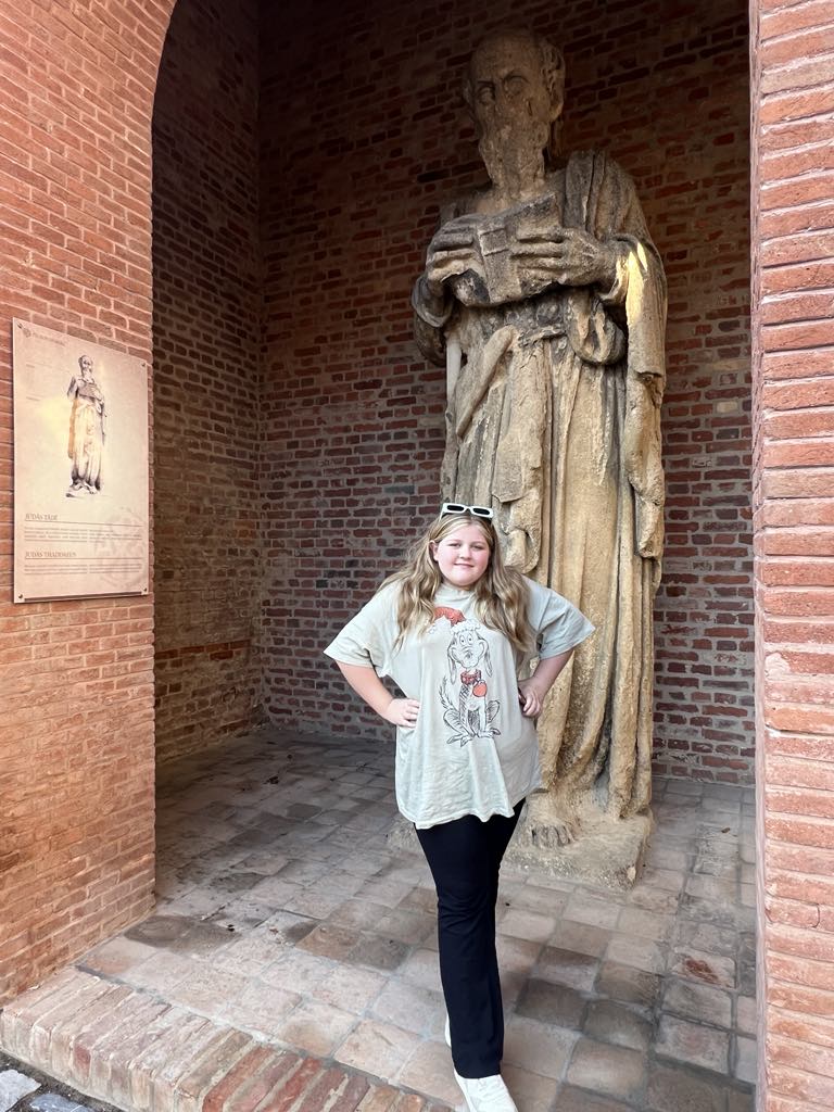 Teen girl Harper with Wandering Apostles Paul statue