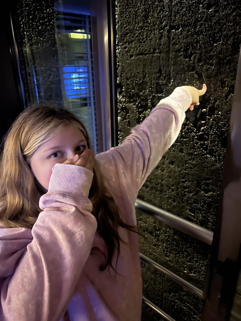 Teen girl Harper touching the wall going through the river locks