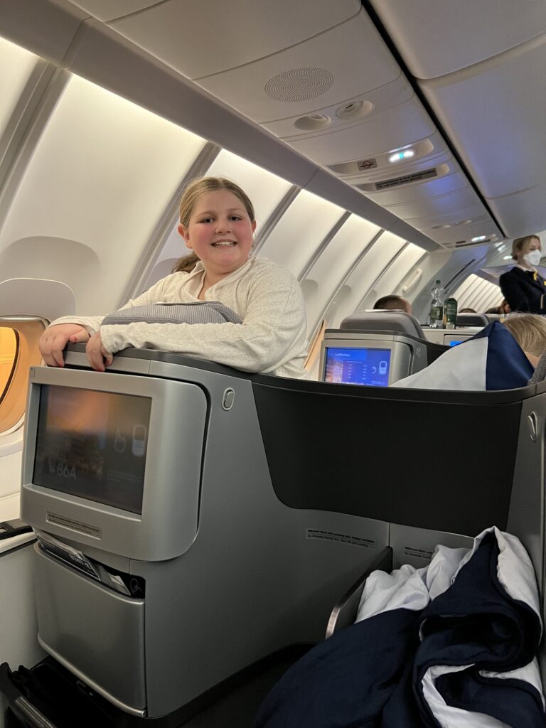 A girl in business class on United Airlines
