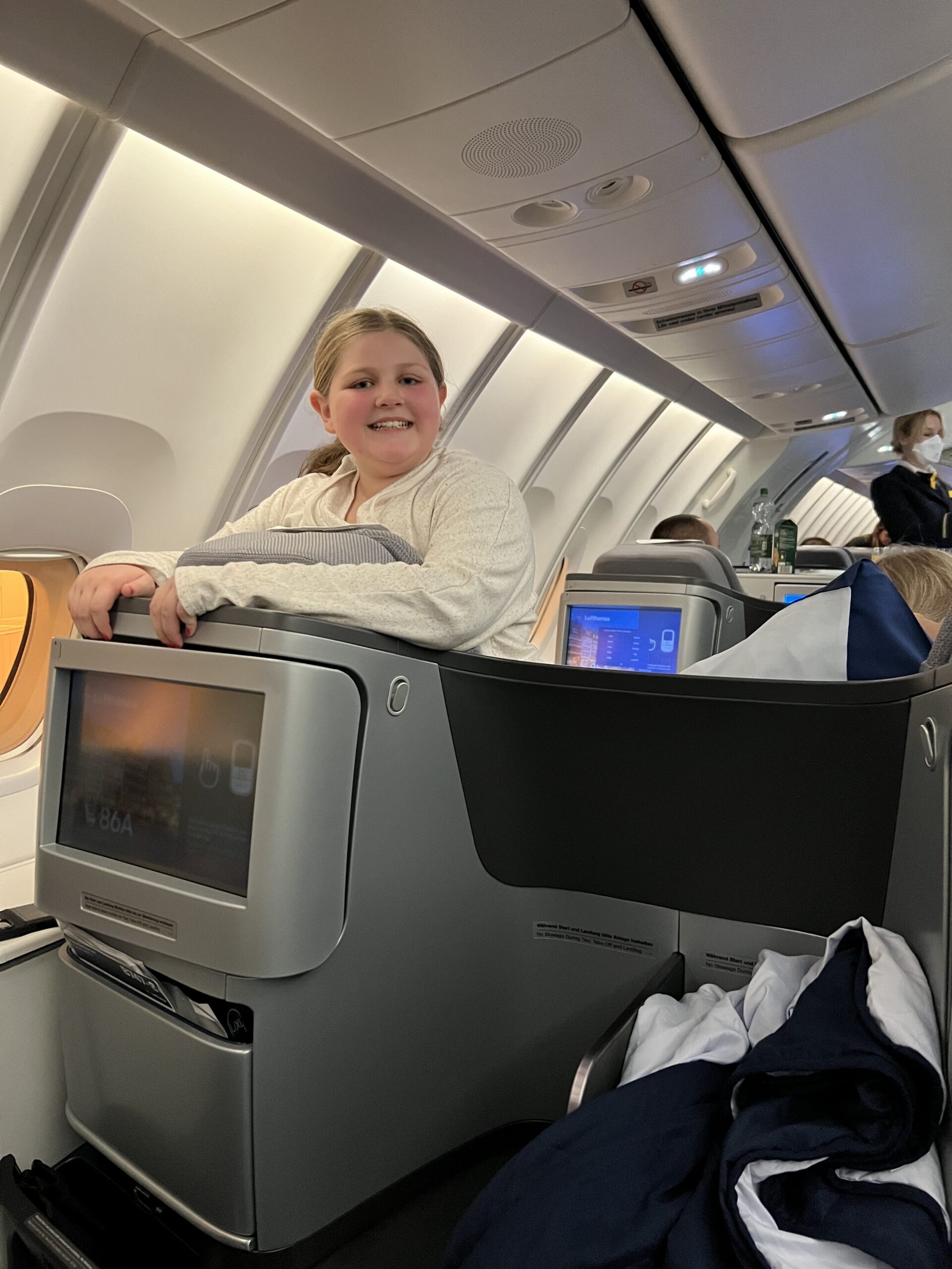 A girl in business class on United Airlines
